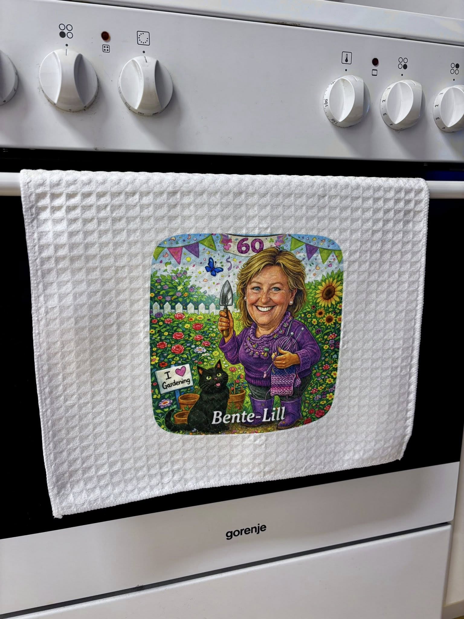 Kopphåndkle med karikatur