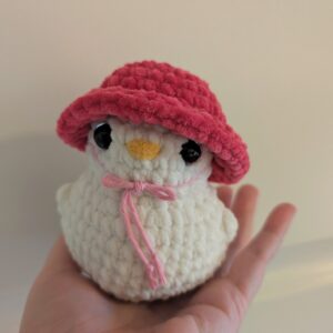 And med rosa hatt